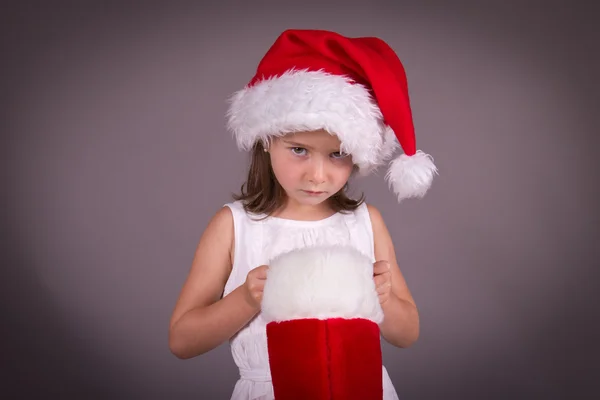 Bambina delusa con la sua calza di Natale — Foto Stock