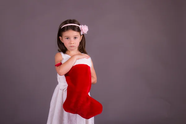 Ragazzina triste con calza di Natale — Foto Stock