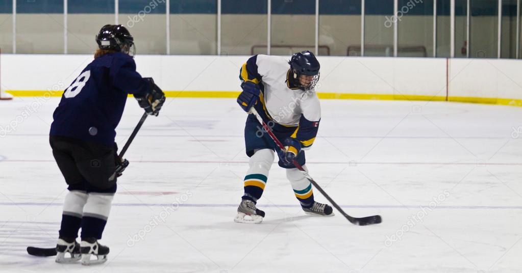 Female ice hockey player in game action
