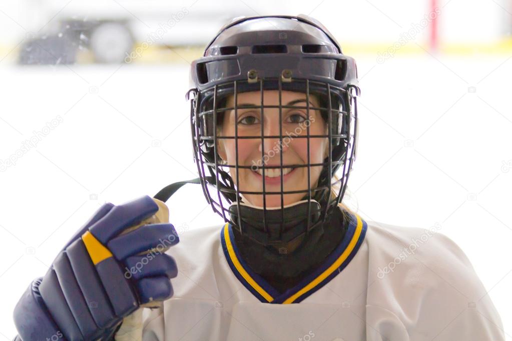 Female ice hockey player after a game
