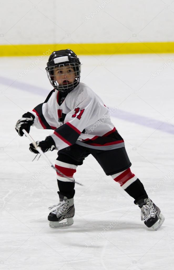 Child playing ice hockey