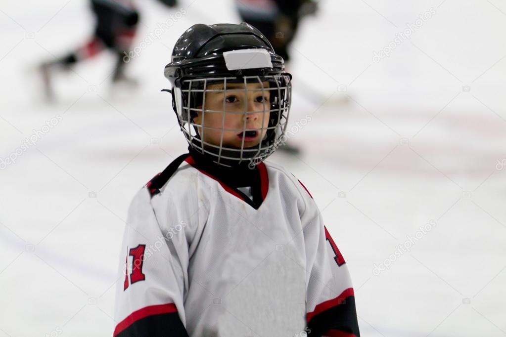 Kid playing ice hockey
