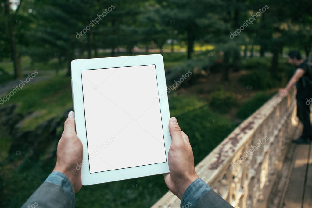 man hands holding tablet