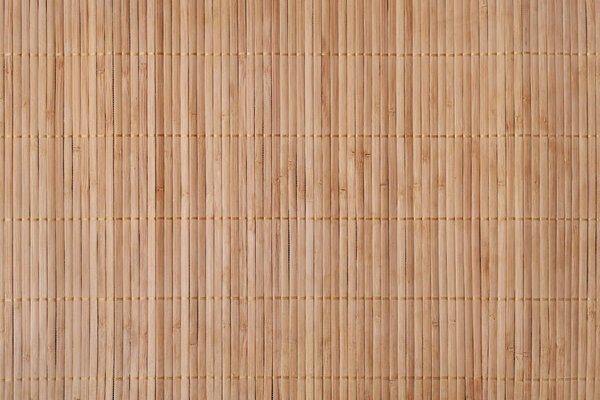 High-resolution texture. Vertically a bamboo rug for the kitchen and everyday life of natural light color.