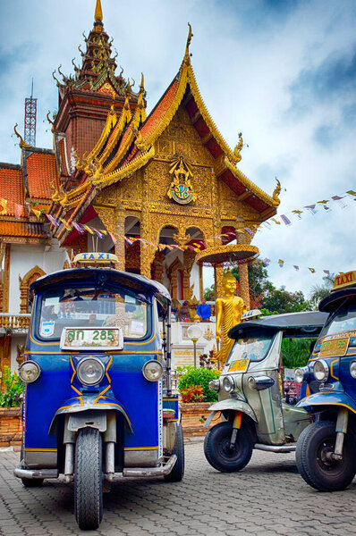 Tuk-tuk in front of Wat Buppharam, Chiang Mai, Thailand