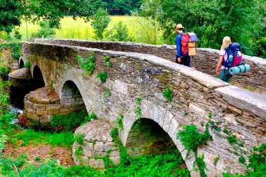 Pilgrims on the Ponte da Aspera on the Camino de Santiago near Sarria, Galicia, Spain clipart