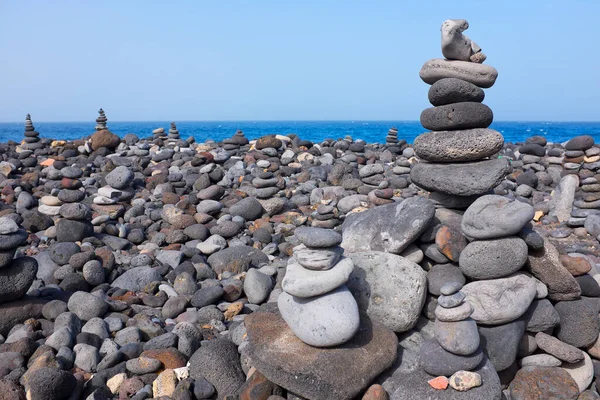 Field of cairns near Playa Jardines, Puerto de la Cruz, Tenerife, Canary Islands, Spain