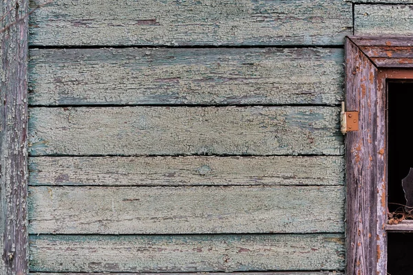 Wooden wall of an old house. Peeling paint. Antiquity texture — Stock Photo, Image