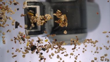 A small vacuum cleaner does the cleaning. Bottom view. You can clearly see how a manual vacuum cleaner sucks up garbage. Garbage from pets, parrot and hamster.