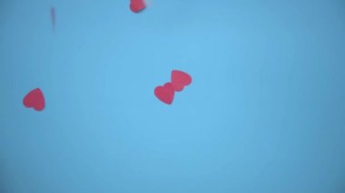 Yukarıdan bak. Beyaz ve kırmızı kalpler mavi arkaplana iniyor. Tatil için arka plan Sevgililer Günü 'dür. Düğün ya da nişan için tebrik ederim. Aşk ilanı.