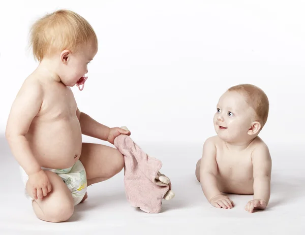 Criança e bebê no fundo branco Fotografia De Stock