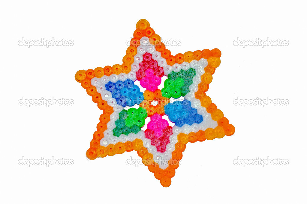 Colorful abstract shape of plastic beads pieced by child
