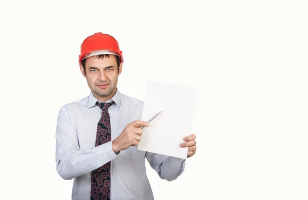 Ingenieur mit rotem Helm zeigt seinen Stift — Stockfoto