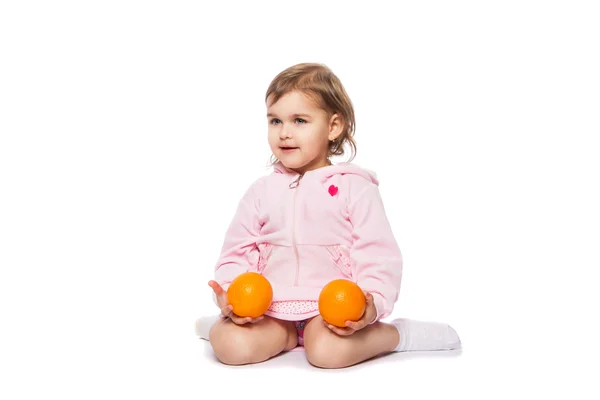 Dziewczynka z pomarańczy — Zdjęcie stockowe