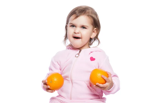 Bambina con arance — Foto Stock