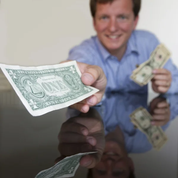 Giving One Dollar — Stock Photo, Image