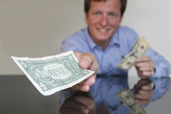 Giving One Dollar — Stock Photo, Image