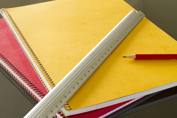 Closed notebooks with pencil and slat — Stock Photo, Image