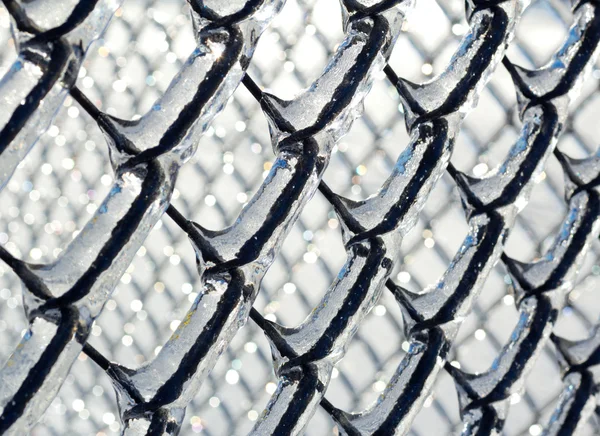 Ice coated chain link fence from an ice storm — Stock Photo, Image