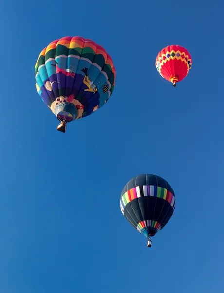METAMORA, MICHIGAN - AUGUST 24 2013: Colorful hot air balloons launch at the annual Metamora Country Days and Hot Air Balloon Festival. Royalty Free Stock Images