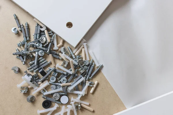 Opened box with furniture assembly parts, closeup — 스톡 사진