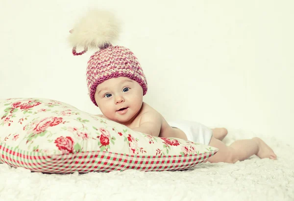 Smiling baby in pink hat — Stock Photo, Image