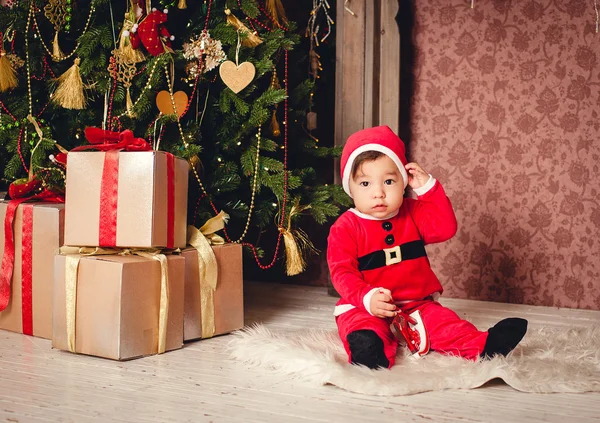 Kid in a Santa suit — Stock Photo, Image