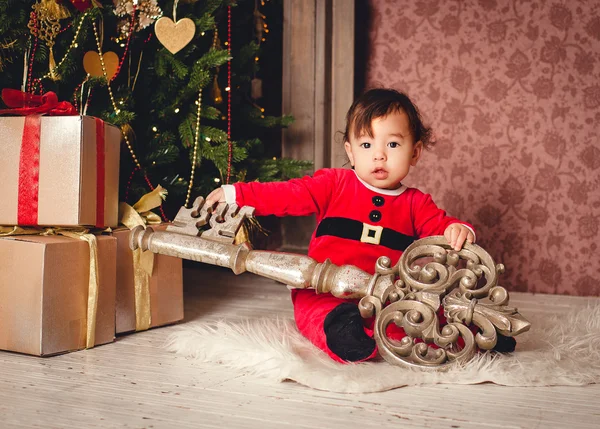 Kid in a Santa suit — Stock Photo, Image