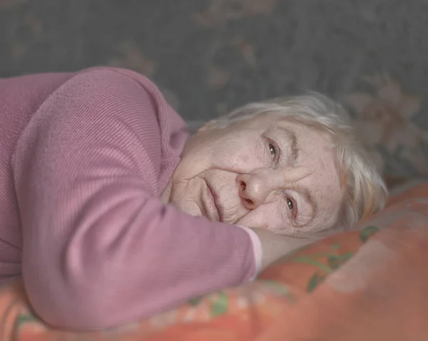 Lonely Elderly Woman Sits Alone Royalty Free Stock Images