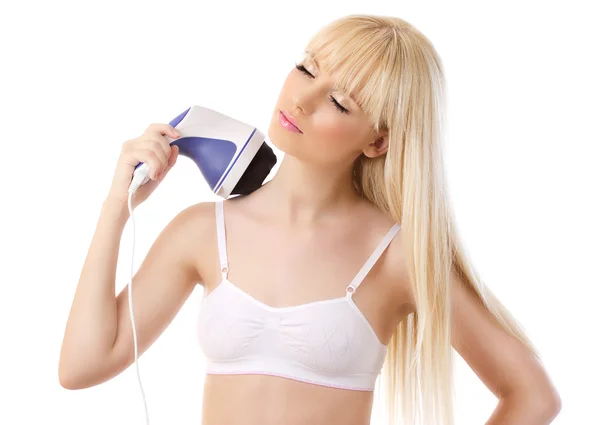 Schöne blonde Frau mit Massagegerät Stockbild