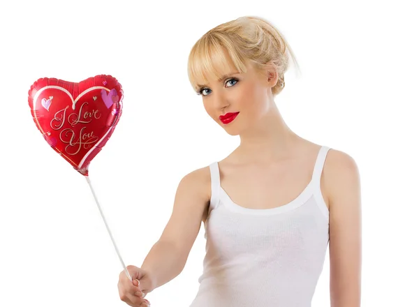 Beautiful young woman with red heart balloon — Stock Photo, Image