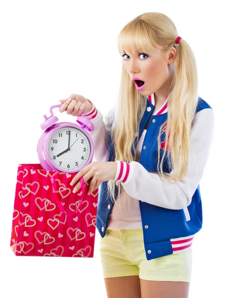 Surprised girl holding clock — Stock Photo, Image
