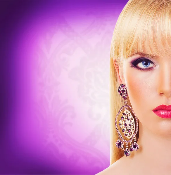 Beautiful blonde girl with earring — Stock Photo, Image