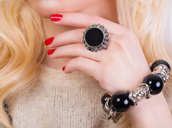 Beautiful blonde girl with red manicure — Stock Photo, Image