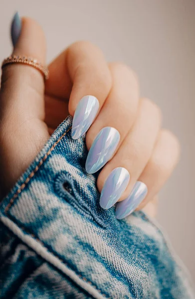 Blue nail manicure. Stylish pastel blue manicure.