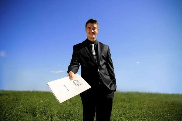 Young man handing a folder — Stock Photo, Image