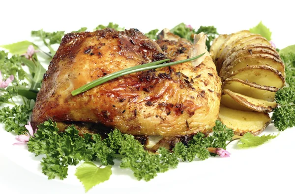 Fried chicken thighs with roast potatoes hasselback — Stok fotoğraf