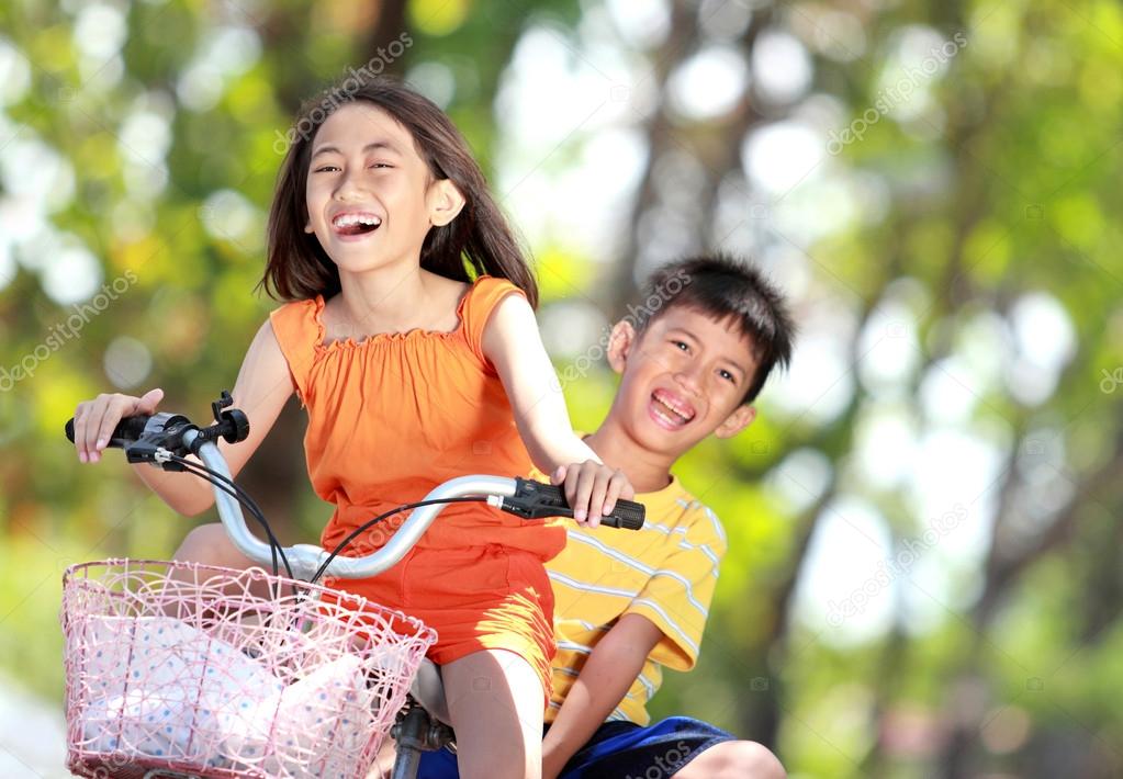 kids riding bike together