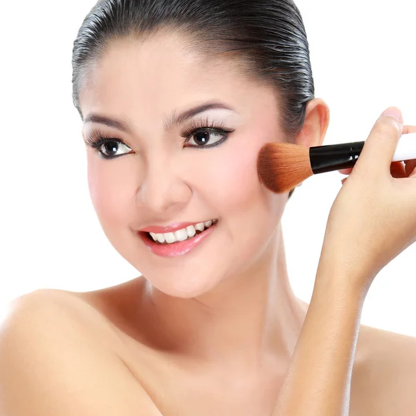 Woman with a make-up brush — Stock Photo, Image