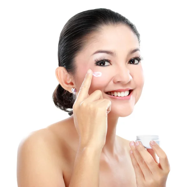 Woman applying moisturizer cream — Stock Photo, Image