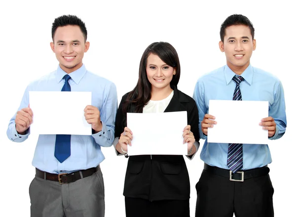 Business team holding blank paper — Stock Photo, Image
