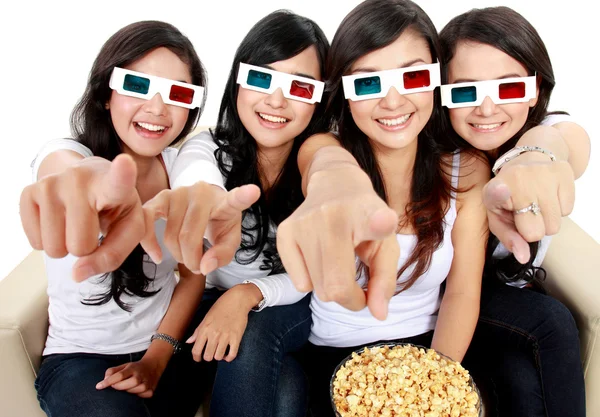Woman pointing to TV while watching 3d movie — Stock Photo, Image