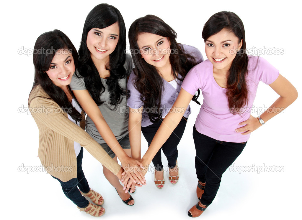 Group of beautiful women with their hands together