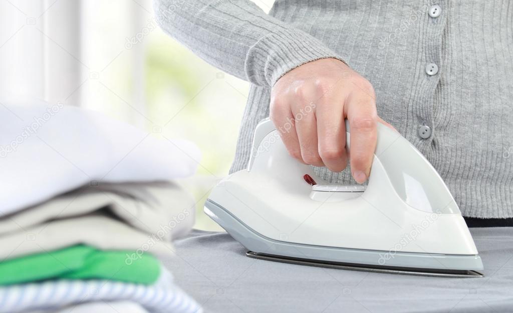Ironing clothes — Stock Photo © odua 23138254