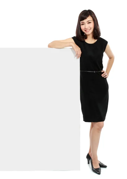 Businesswoman holding a blank board — Stock Photo, Image