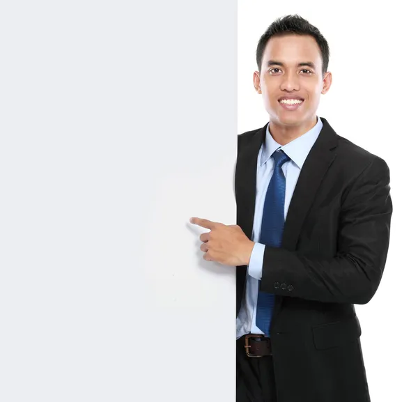 Smiling asian business man holding empty board — Stock Photo, Image