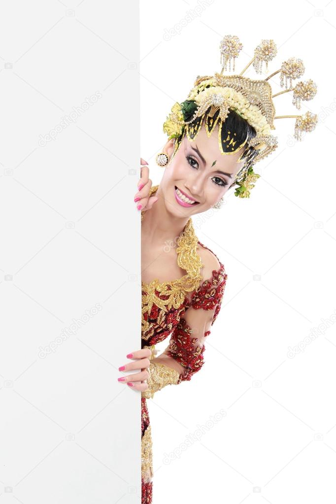woman with traditional dress of java with blank board