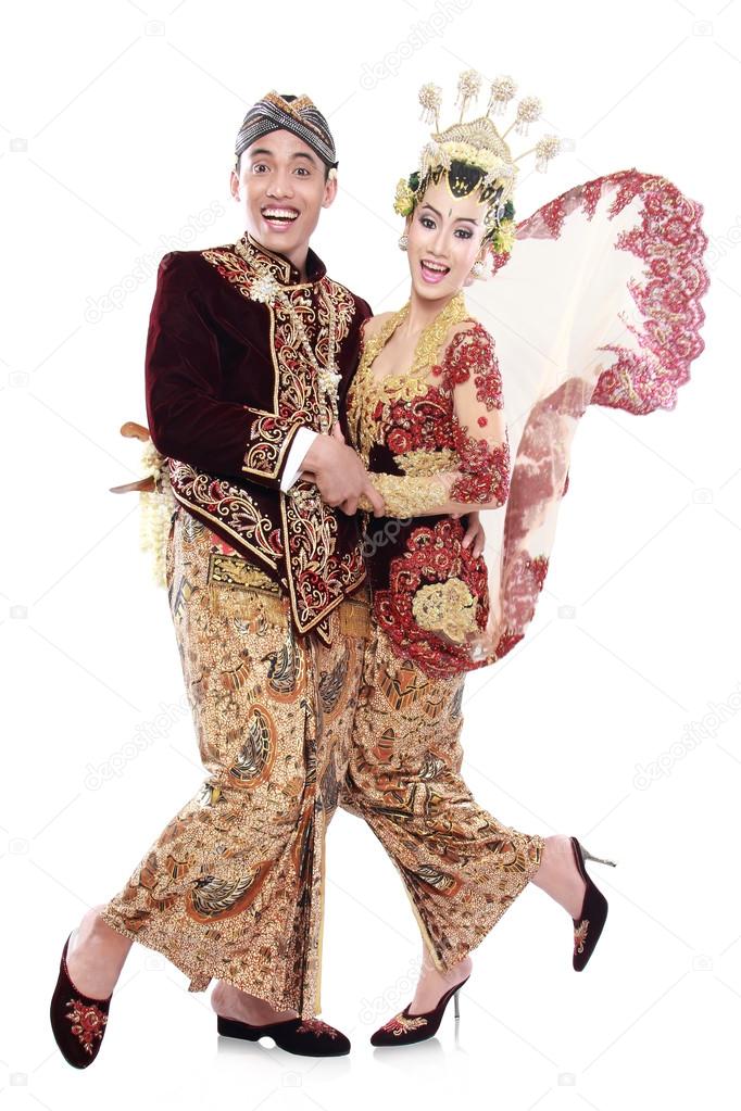 happy traditional java wedding couple