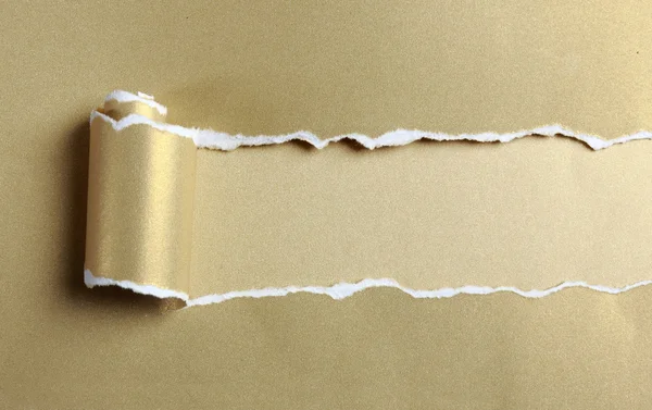 Ripped gold paper — Stock Photo, Image