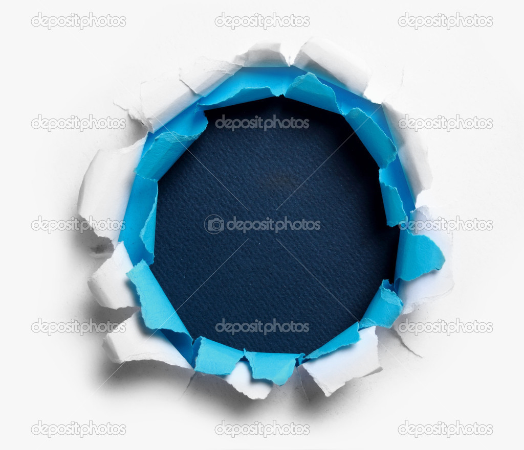 Hole ripped in white and blue paper